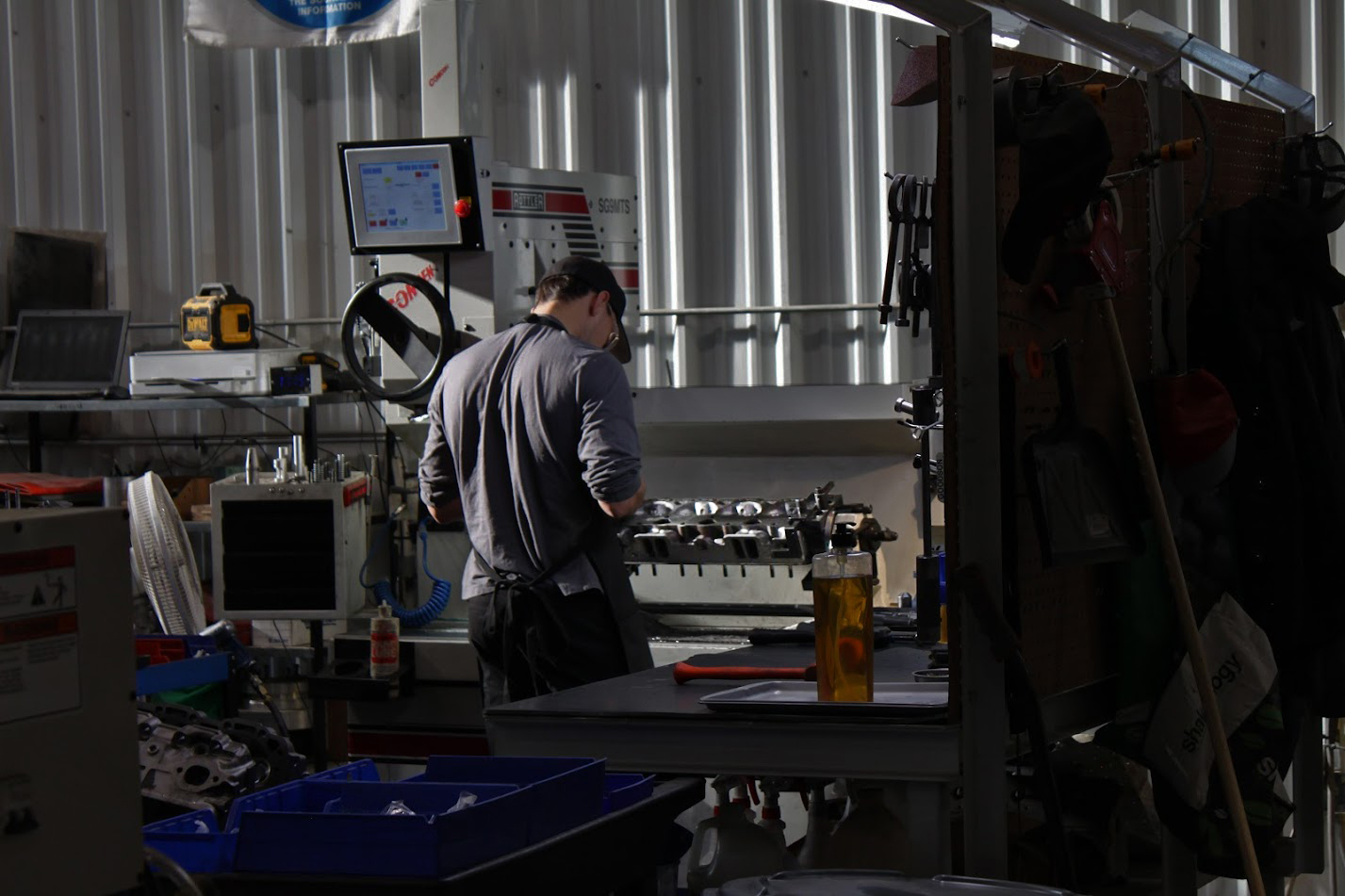 Technician rebuilding engine components at Upstream Data Lloydminster machine shop – member of AERA Engine Builders Association